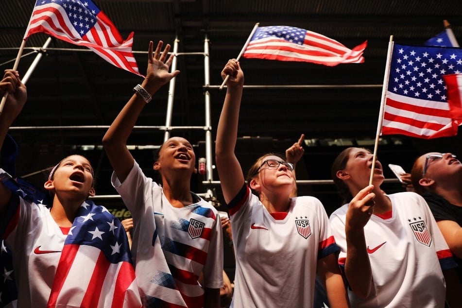 Young fans cheer as members of the US Women's National Soccer Team travel down the "Canyon of Heroes" in a New York City ticker tape parade after winning the 2019 Women's World Cup.