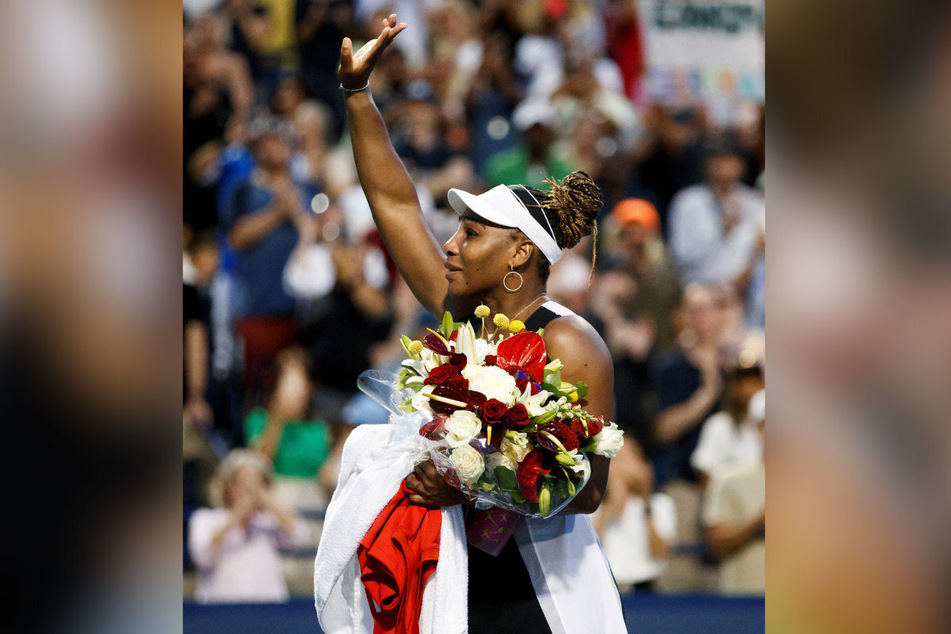 Williams waves to the crowd after her exit from the National Bank Open in Toronto.