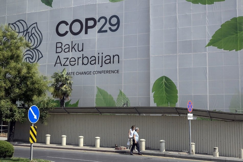 Branding for the COP29 climate conference covers the facade of a building under renovation in the Azerbaijani capital of Baku.