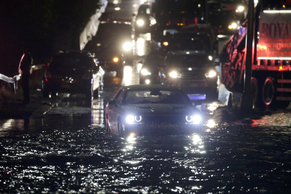 Cars are left stranded on the Long Island Expressway due to flooding from Tropical Storm Ida.