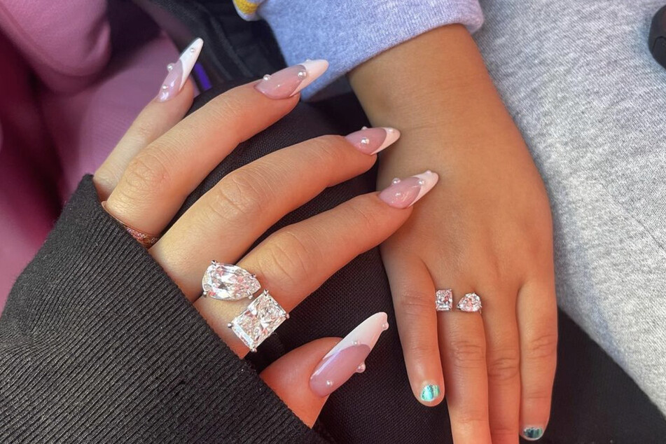 On Tuesday, Kylie Jenner shared pics of the matching diamond rings Travis Scott got for her and their daughter, Stormi.