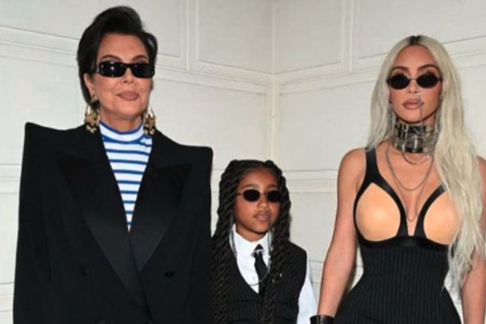 North West (c) was also seen watching her mom Kim Kardashian walk the runway at the Balenciaga's 51st Couture Collection showcase with Kris Jenner.