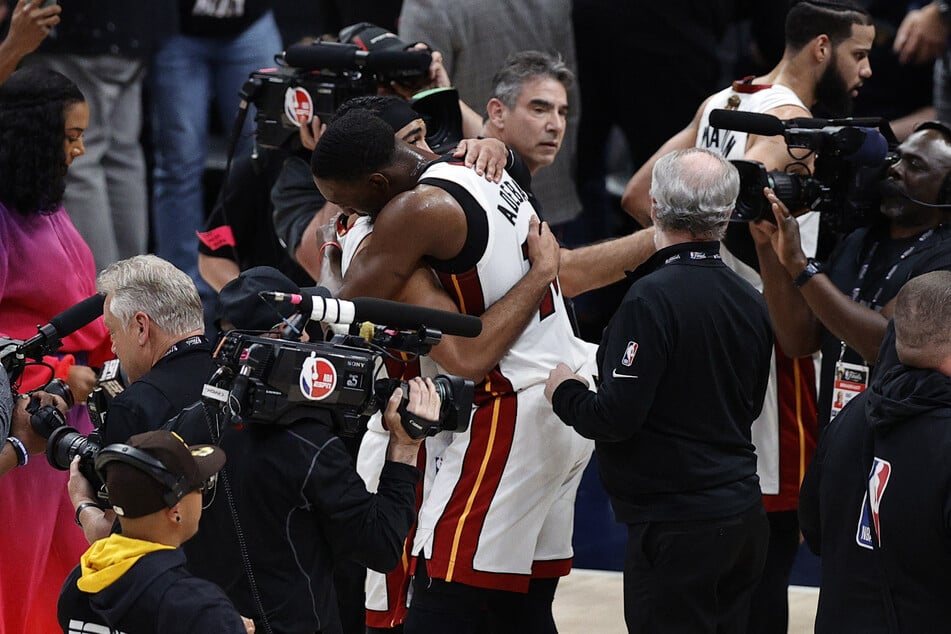 Gabe Vincent and Bam Adebayo embrace after the Miami Heat rally in the fourth quarter to beat the Denver Nuggets in Game 2 of the NBA Finals.