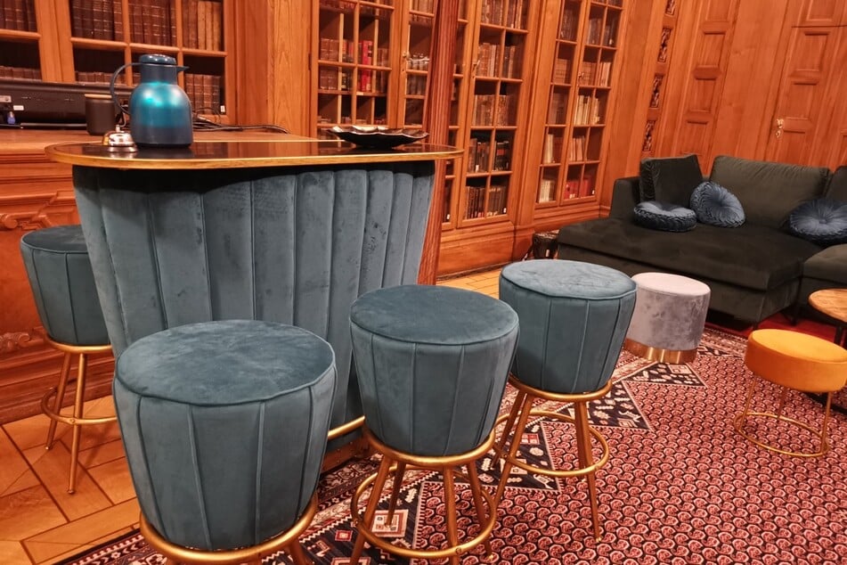 A bar has been set up in the old library in place of the historic chairs.