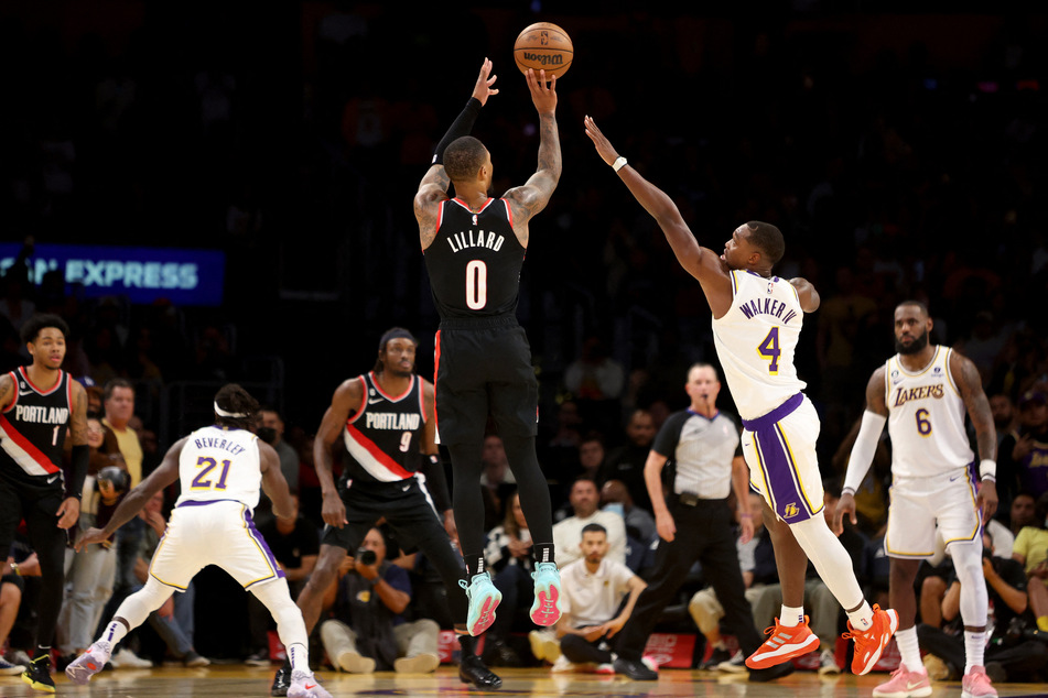 Portland Trail Blazers guard Damian Lillard shoots a three-pointer against Los Angeles Lakers guard Lonnie Walker IV during the fourth quarter at Crypto.com Arena.