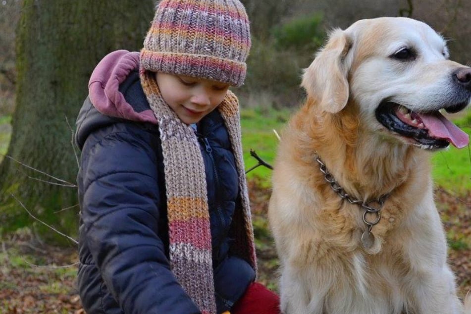 Daniel (7) and dog Basco are finally reunited.