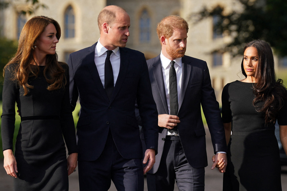 Meghan Markle (r.) is allegedly the reason Prince Harry (second from r.) and Prince William (second from l.) have not reconciled.
