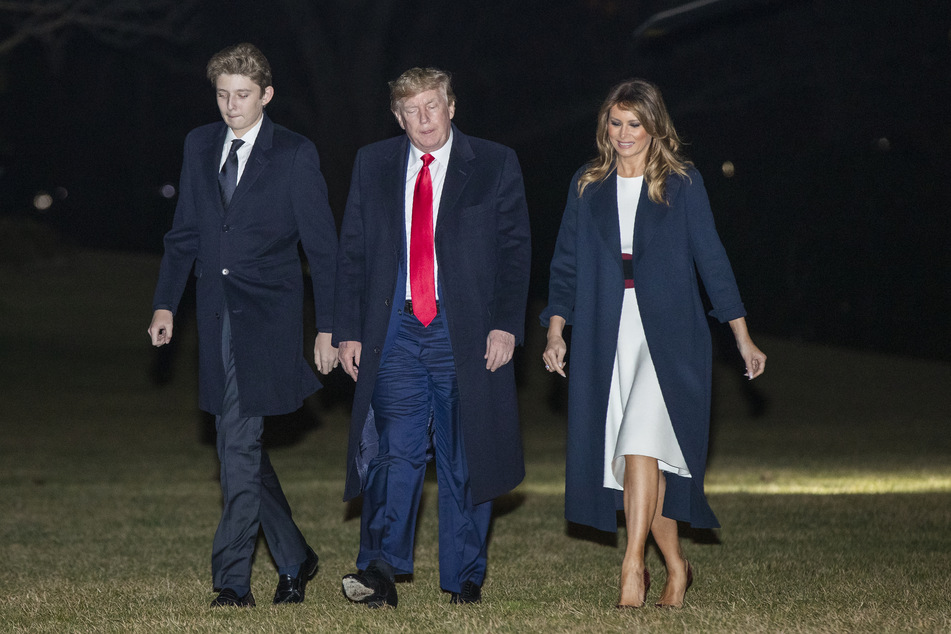 Donald Trump, Präsident der USA, die First Lady Melania Trump und ihr gemeinsamer Sohn Barron Trump.