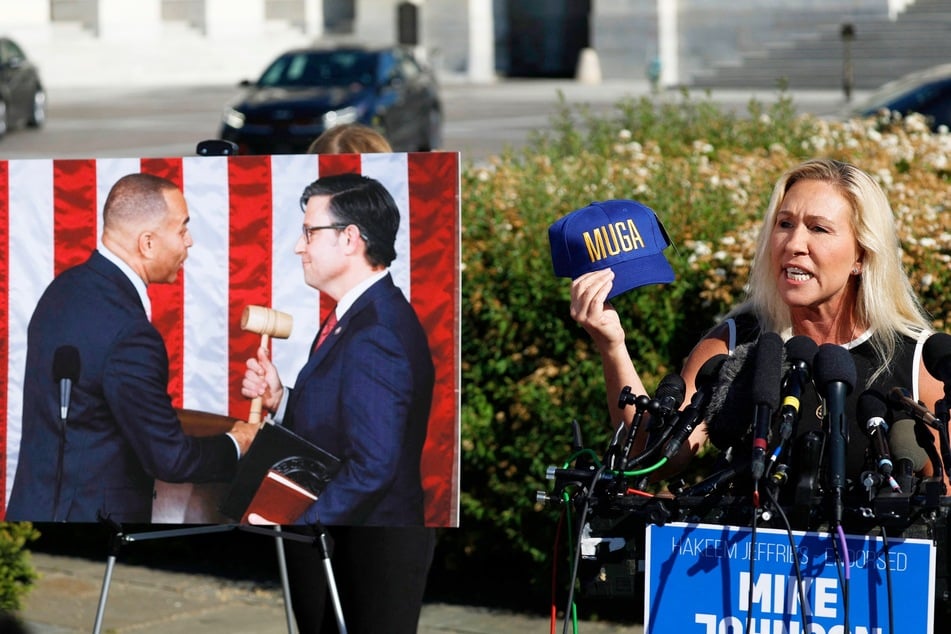 Marjorie Taylor Greene (r.) holding up a hat that says "MUGA" or "Make Ukraine Great Again" as she spoke at a news conference regarding Speaker Mike Johnson last week (c.).