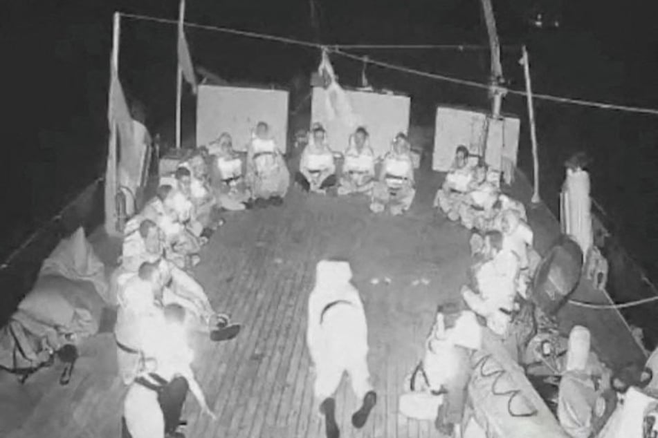 Crew members onboard a vessel sailing as part of the Global Sumud Flotilla prepare to be illegally boarded by Israeli forces.