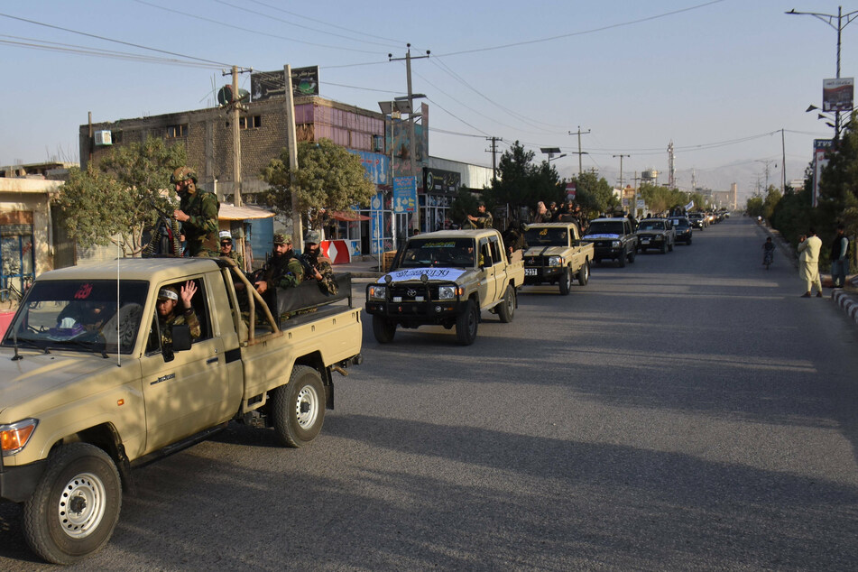 Taliban military vehicles lined the streets in Mazar-i-Sharif, the capital of northern Balkh province in Afghanistan, on Tuesday.