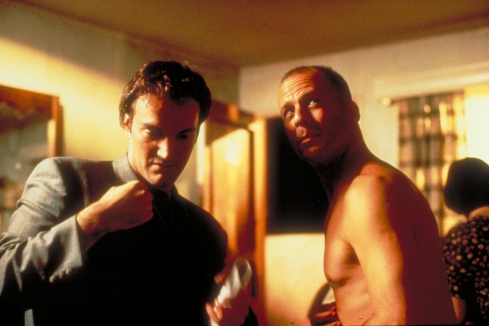 Quentin Tarantino (left) alongside Bruce Willis in a scene from Pulp Fiction.