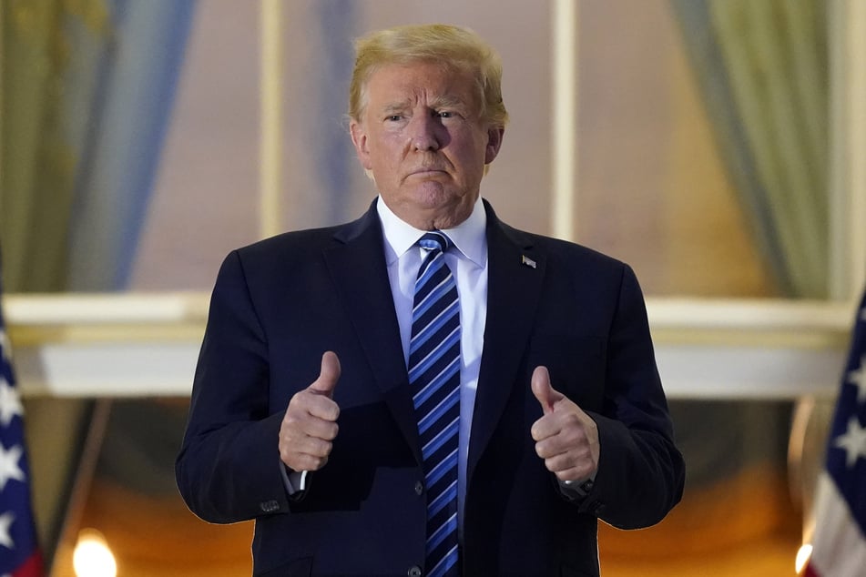 Donald Trump standing on the Truman balcony of the White House.
