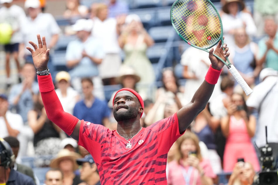 Frances Tiafoe of the US celebrates after beating Yoshihito Nishioka of Japan on day two of the 2025 US Open tennis tournament.