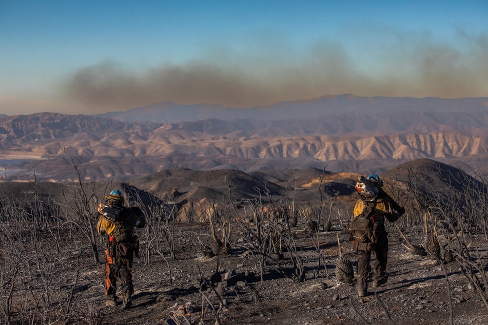 A massive response involving aircraft, bulldozers, and 4,000 personnel had swung into action as flames raced across hillsides in Castaic, 35 miles north of Los Angeles.