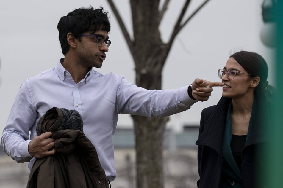 Representative Alexandria Ocasio-Cortez (l.) and her Chief of Staff Saikat Chakrabarti arrive at a press conference to announce the Green New Deal on February 7, 2019.