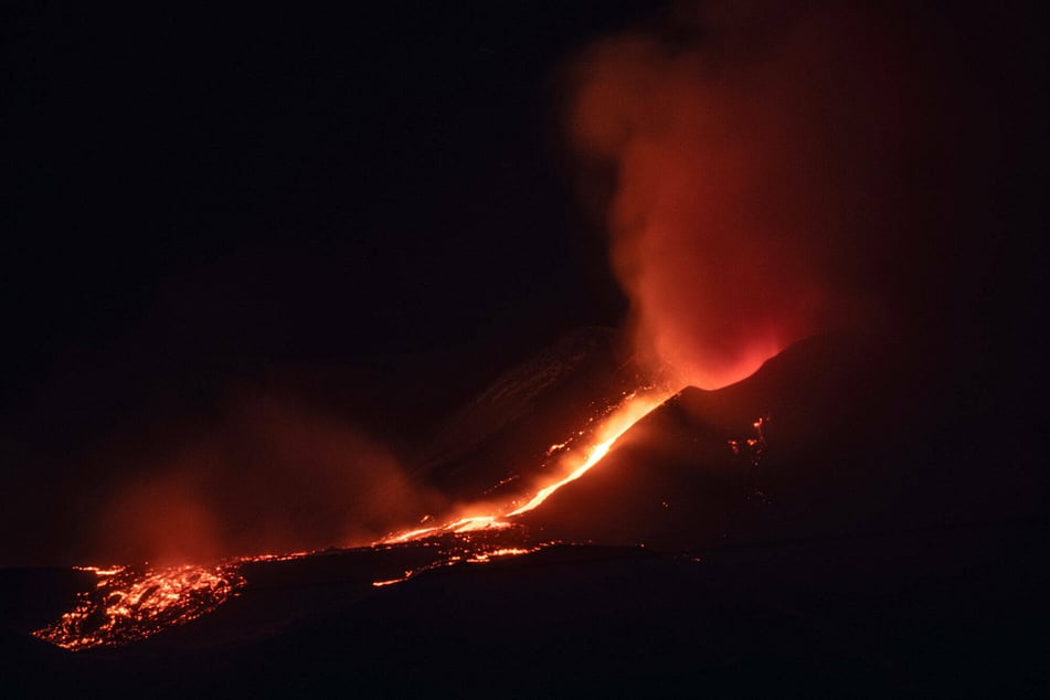 Lava flows down the crater of Mount Etna after an eruption.