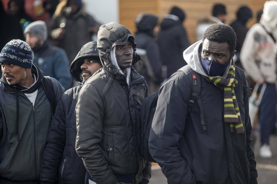 Black refugees wait to cross the border from Ukraine into Poland.