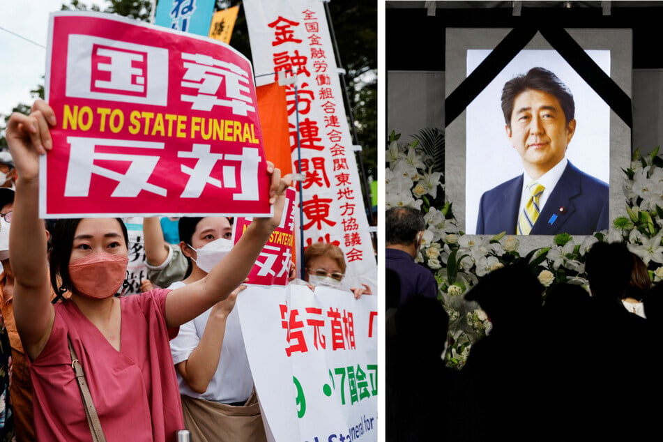 People lay flowers and pay their respects to the late Shinzo Abe outside Nippon Budokan Hall as thousands gathered to protest the former Japanese prime minister's state funeral.