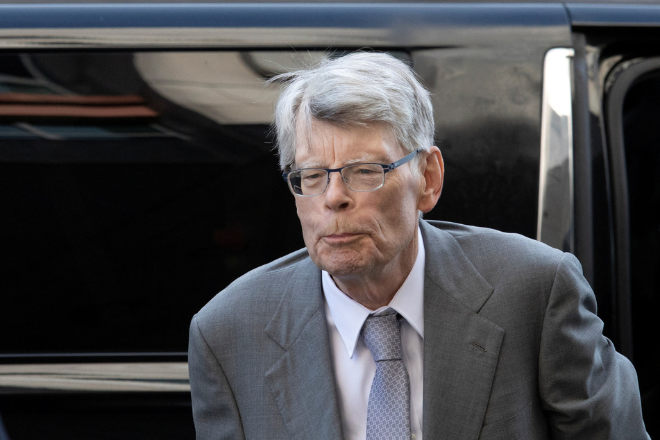 Novelist Stephen King walks outside the US District Court in Washington on the day he testifies in an antitrust case against a publisher merger.