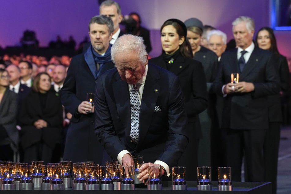 King Charles (76) lit a candle with other heads of state during the service.