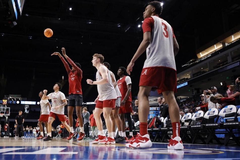 On the opening day of the March Madness Tournament, Alabama basketball is surrounded in more scandal following a report about more players' involvement in a fatal shooting.