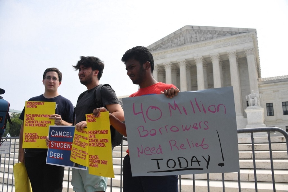 Protesters outside the Supreme Court demand the student loan payment pause continue until cancellation is delivered.