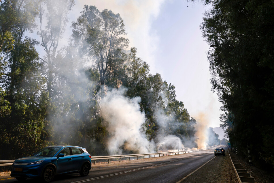 Smokes rises from the woods which caught fire following rockets launched from Lebanon into northern Israel, close to the city of Kiryat Shmona near the southern Lebanon border, on June 4, 2024.