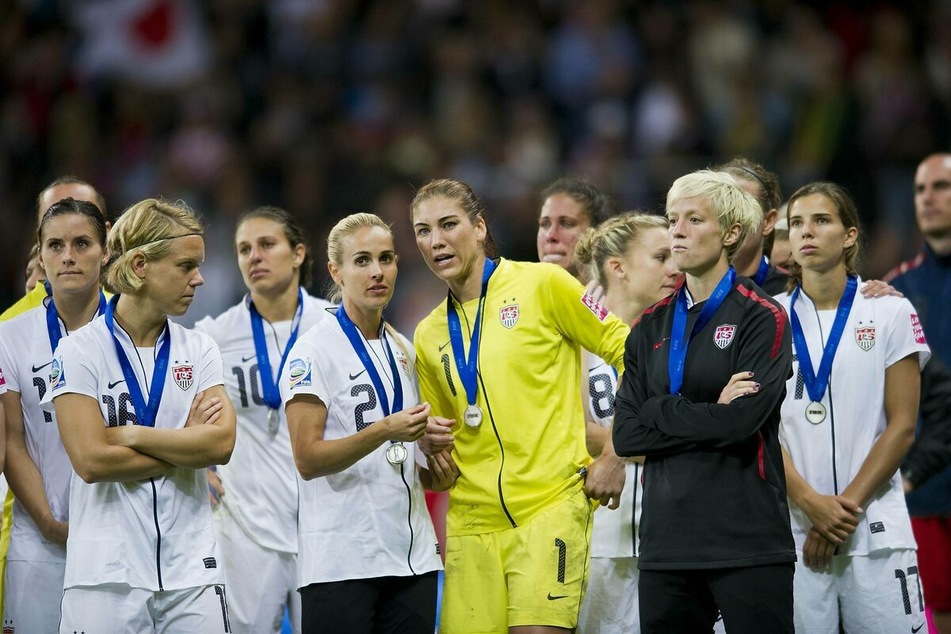 USWNT players stood together after a World Cup game in 2011.