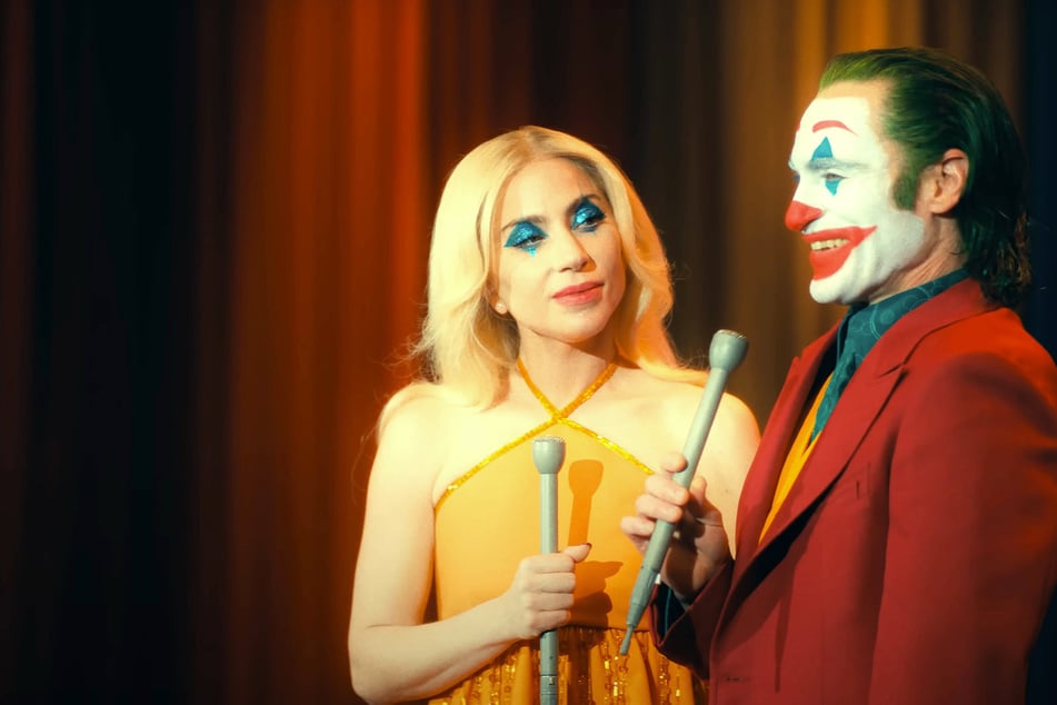 Joaquin Phoenix (r.) returns alongside Lady Gaga in Joker: Folie à Deux, the sequel now getting an international cinematic release in October.