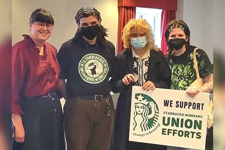 Starbucks workers at the North Charles St. store in Baltimore celebrate their successful union vote.