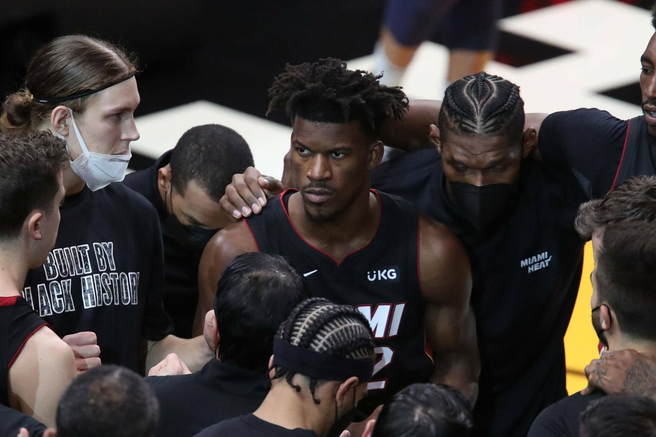 Jimmy Butler (c.) looks to lead the Heat back to the NBA Finals after falling short last year to the Lakers in six games.