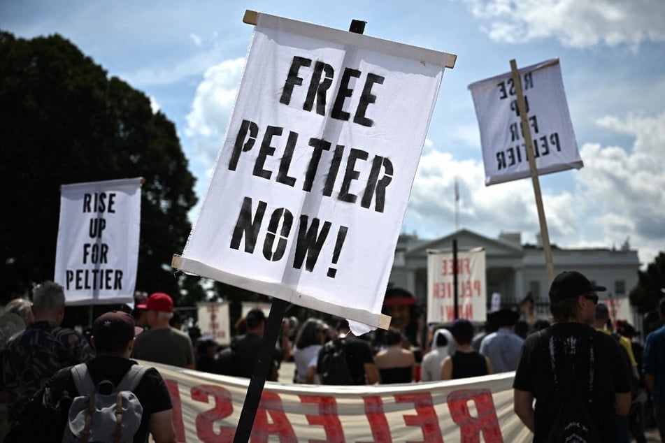 Indigenous activists and allies rally in front of the White House to demand Leonard Peltier's release from prison.