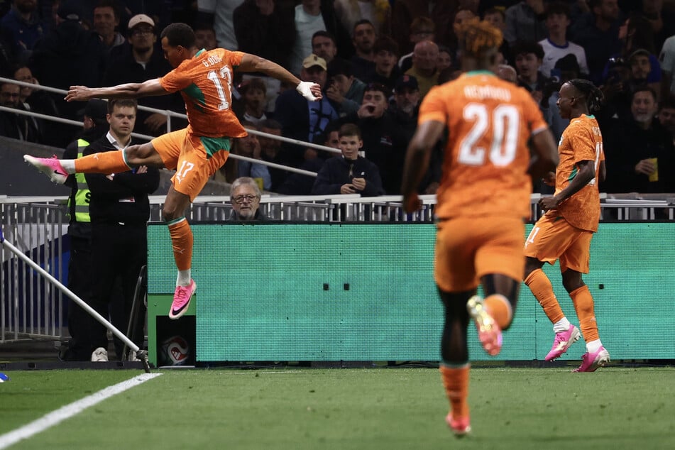 Ivory Coast's defender Guela Doue celebrates scoring the equalizing goal during the international friendly match against France ahead of the 2026 FIFA World Cup at the Stade de la Beaujoire in Nantes on June 4, 2026.