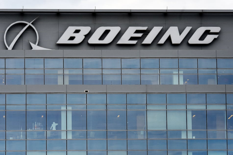 Boeing agreed on a preliminary new contract with union leaders that includes a hefty wage hike that would avert a strike in the Seattle region, the two sides announced Sunday.