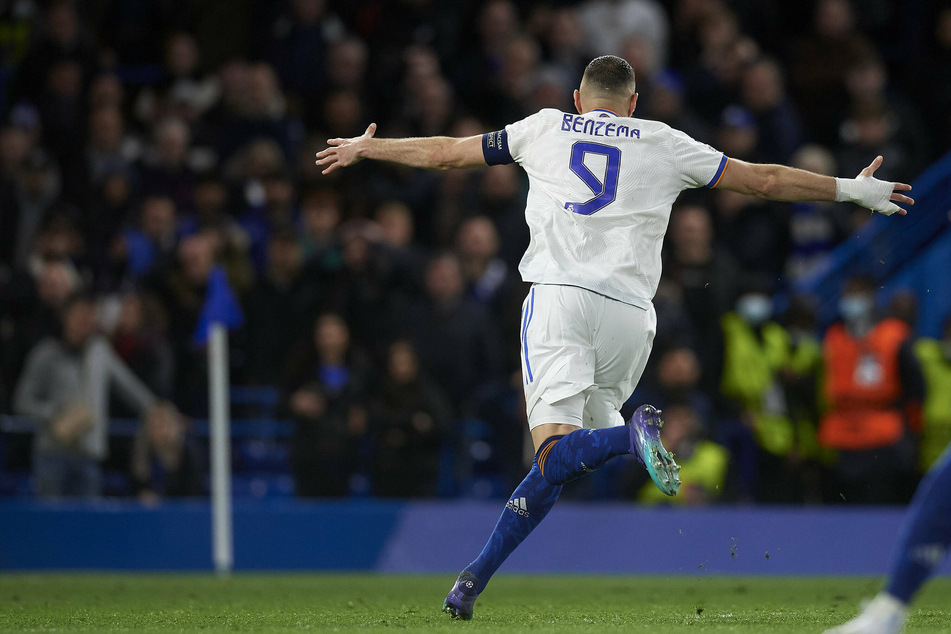 Karim Benzema celebrates his third goal against Chelsea.