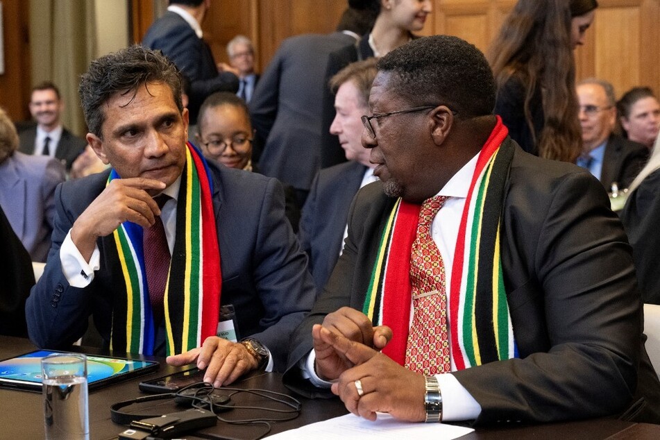 Legal advisor of South Africa Cornelius Scholtz (l.) and South African Ambassador to the Netherlands Vusimuzi Madonsela are pictured after presenting their arguments before the International Court of Justice.