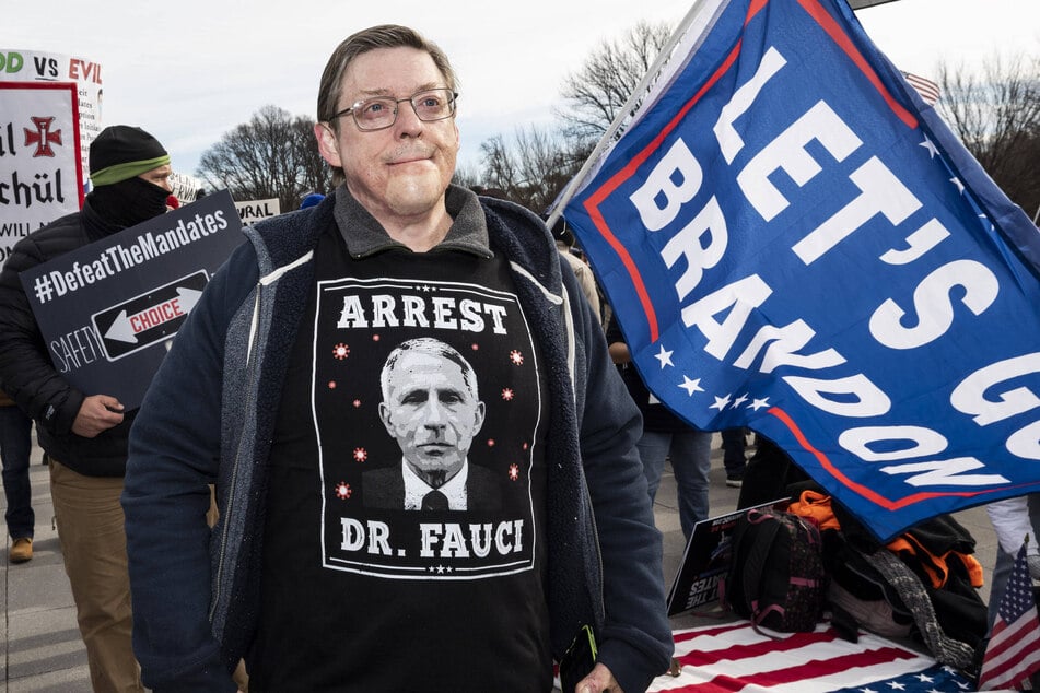 Man wearing a shirt saying Arrest Dr. Fauci at the Defeat the Vaccine Mandates Rally in Washington DC on January 23, 2022.