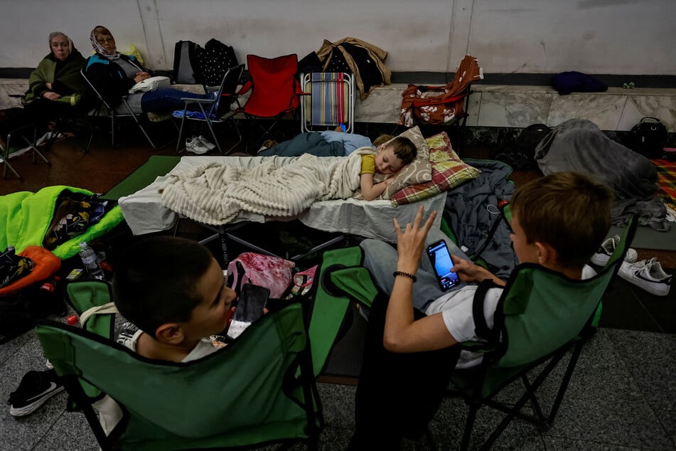 People take shelter inside a metro station during a Russian drone and missile strike in Kyiv, Ukraine, on July 3, 2025.