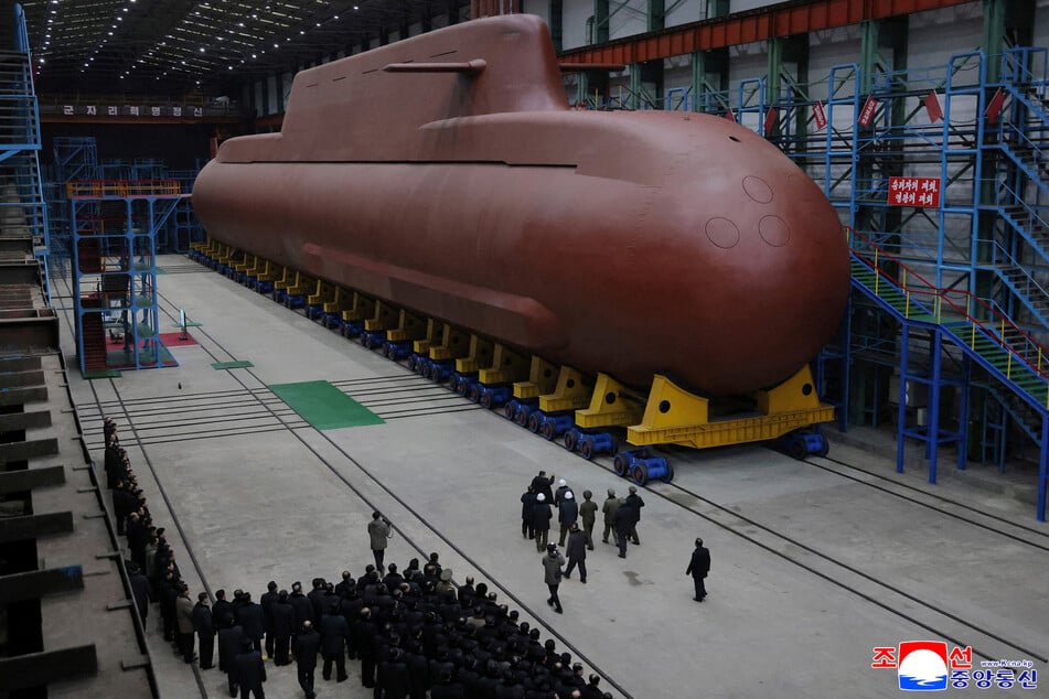 North Korean leader Kim Jong-un visited a nuclear submarine factory as Pyongyang ramps up its military production.