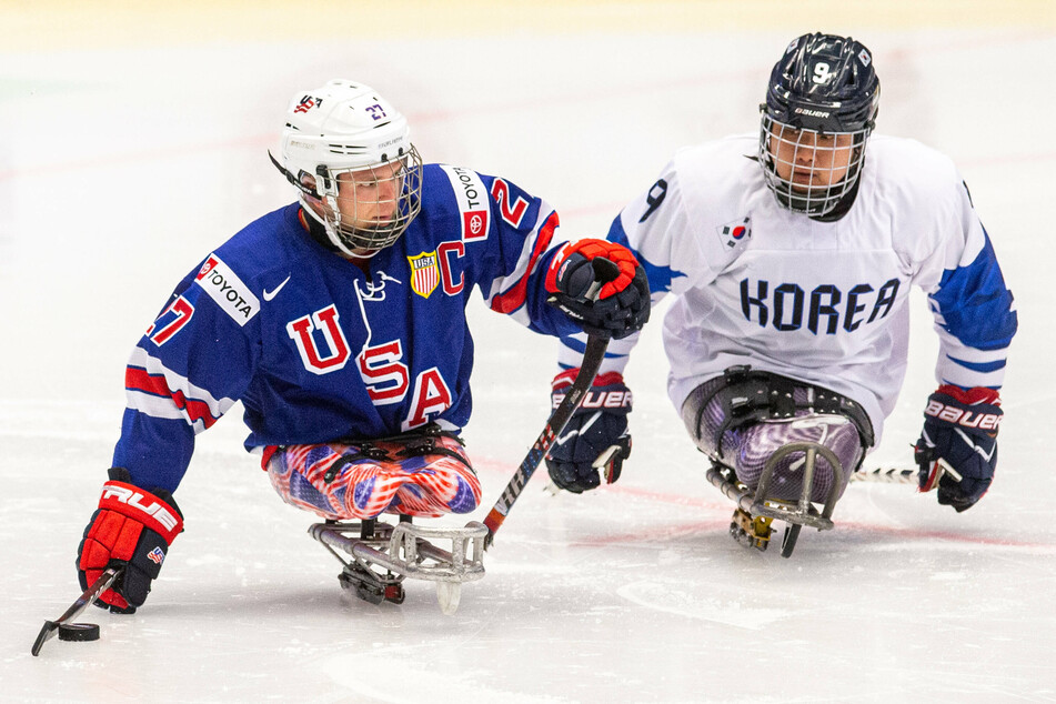 Sled hockey captain Josh Pauls (l.) looks to lead Team USA to its fourth-straight gold medal in Beijing.