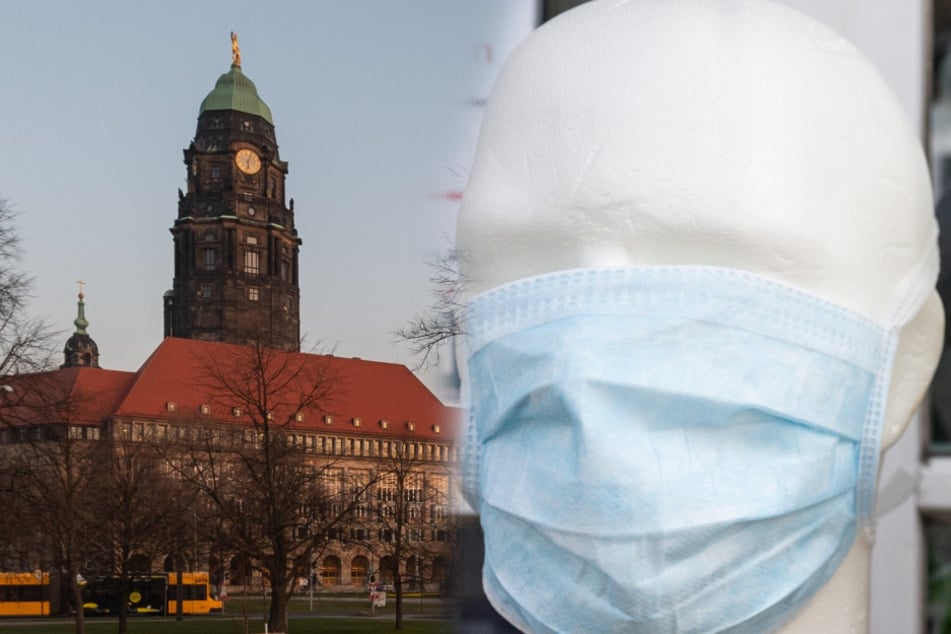 Vor der Goldenen Pforte des Dresdner Rathauses werden die Mundschutzmasken verteilt (Symbolbild).