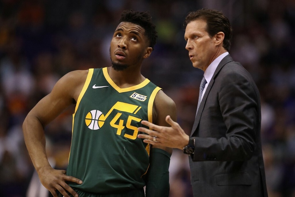 Head coach Quin Snyder giving advice Donovan Mitchell during a game against the Phoenix Suns.