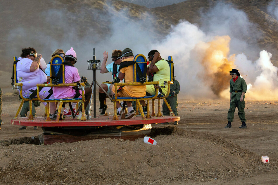 (From l. to r.) Zach Holmes, Dave England, Eric Manaka, Sean Poopies McInerney, Steve-O, Jasper, and Johnny Knoxville in a segment called "The Vomitron." We're sure you can imagine what comes next.