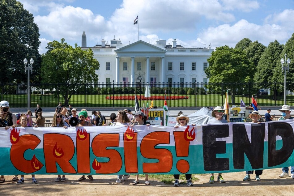 Protesters rally for climate action outside the White House in Washington DC.