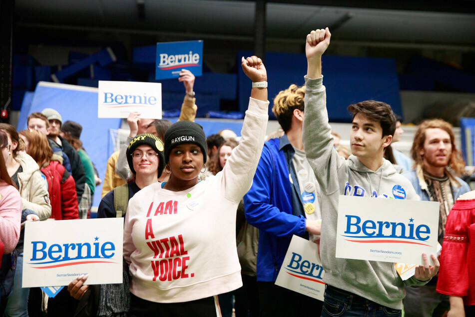 Bernie Sanders supporters in Des Moines participate in the 2020 Iowa Caucus.