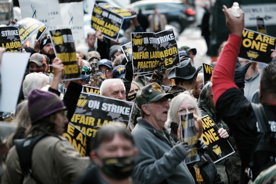 Hundreds of members of the United Mine Workers of America march to the Manhattan headquarters of BlackRock, the largest shareholder in the mining company Warrior Met Coal.