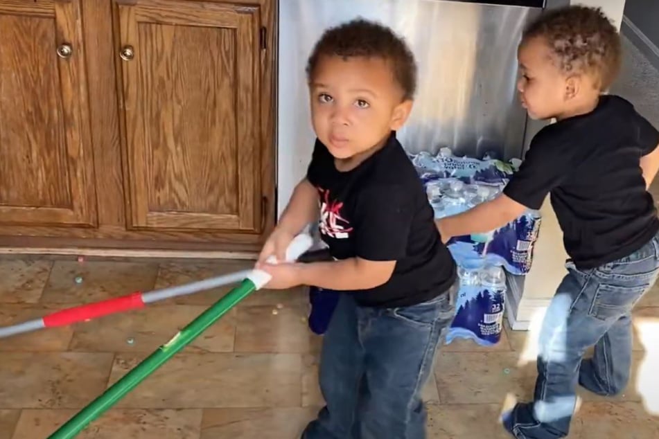 The Hurtt twins had a cleaning contest after making a huge breakfast-based mess.