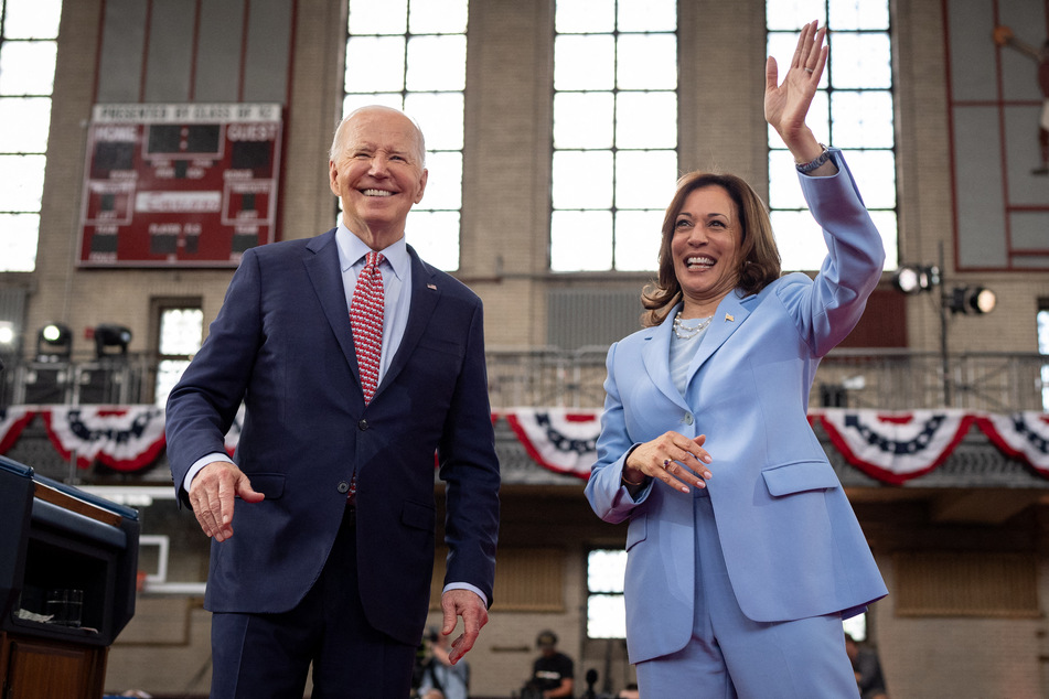 US President Joe Biden (l.) and US Vice President Kamala Harris (r.) wave to members of the audience after speaking at a campaign rally at Girard College on May 29, 2024 in Philadelphia, Pennsylvania.