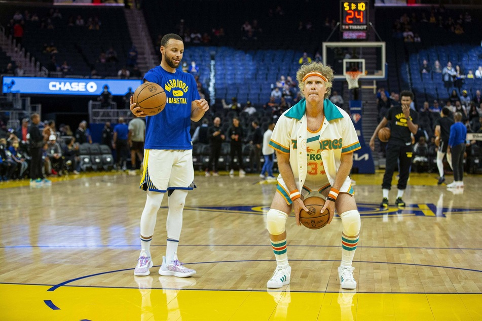The Warriors' Steph Curry watches on as actor Will Ferrell takes a shot.
